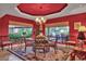 Inviting dining room featuring a round table, chandelier, and large windows showcasing the outdoors at 8003 E Sands Dr, Scottsdale, AZ 85255