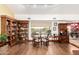 Living area highlighting custom built-in bookshelves and seating, and a view to the outdoors at 8003 E Sands Dr, Scottsdale, AZ 85255