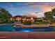 Beautiful swimming pool with a lush backyard and sunset views at 8003 E Sands Dr, Scottsdale, AZ 85255