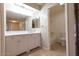 Well-lit bathroom with double vanity, clean fixtures, and a shower-tub combo at 8666 E Fillmore St, Scottsdale, AZ 85257