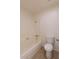 This bathroom includes a tub and shower combo, plus a toilet against a neutral wall at 8666 E Fillmore St, Scottsdale, AZ 85257