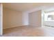 Spacious bedroom with tile flooring, neutral colors, and an ensuite bathroom at 8666 E Fillmore St, Scottsdale, AZ 85257