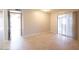 Well lit bedroom with tile floor and a sliding glass door to patio at 8666 E Fillmore St, Scottsdale, AZ 85257