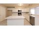 Renovated kitchen boasting ample countertop space, modern appliances, and stylish flooring at 8666 E Fillmore St, Scottsdale, AZ 85257