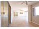 This living area features an expansive tile floor and is illuminated by natural light from sliding glass doors at 8666 E Fillmore St, Scottsdale, AZ 85257