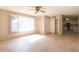 Spacious living room with tile flooring, large windows, and neutral paint at 8666 E Fillmore St, Scottsdale, AZ 85257