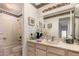 Well-lit bathroom featuring a tub-shower combination and a vanity with ample counter space at 9445 W Taro Ln, Peoria, AZ 85382