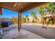 Covered patio view of brick pavers, privacy wall and mature landscaping at 11226 W Glenrosa Ave, Phoenix, AZ 85037