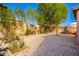 Backyard with brick pavers, privacy wall and mature landscaping at 11226 W Glenrosa Ave, Phoenix, AZ 85037