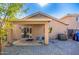 Backyard with brick pavers, privacy wall and covered patio at 11226 W Glenrosa Ave, Phoenix, AZ 85037