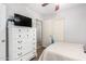 Bedroom featuring a white dresser, a ceiling fan, and a doorway to another room at 11226 W Glenrosa Ave, Phoenix, AZ 85037