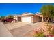 Charming home exterior features a two-car garage, driveway, and drought-tolerant landscaping at 11226 W Glenrosa Ave, Phoenix, AZ 85037