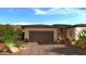 Home with a garage, desert landscape, and driveway showing the desert environment around the residence at 12326 E Black Rock Rd, Scottsdale, AZ 85255