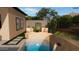 Inviting outdoor pool with water feature, two lounge chairs, and stepping stones at 12326 E Black Rock Rd, Scottsdale, AZ 85255