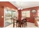 View of the dining area with sliding door access to the backyard patio at 1268 S 238Th Ln, Buckeye, AZ 85326