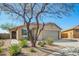 Charming single-story home with desert landscaping, two car garage and covered entryway at 1268 S 238Th Ln, Buckeye, AZ 85326