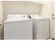 A well-lit laundry room includes a washing machine and a dryer at 1268 S 238Th Ln, Buckeye, AZ 85326