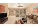 Comfortable living room showcasing neutral colors, carpet, modern furniture, and a ceiling fan at 1268 S 238Th Ln, Buckeye, AZ 85326