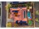 Birds-eye view of a property showcasing a red tile roof, pool, courtyard, and integrated solar panels at 1708 W Gambit Trl, Phoenix, AZ 85085