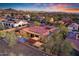 Overhead view of a house with a red-tiled roof, solar panels, and meticulously designed outdoor living spaces at 1708 W Gambit Trl, Phoenix, AZ 85085