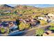 Scenic aerial shot of a property with mountains in the background and well-maintained desert landscaping at 1708 W Gambit Trl, Phoenix, AZ 85085