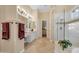 This luxurious bathroom offers a walk-in shower, soaking tub, and a vanity with ample counterspace at 1708 W Gambit Trl, Phoenix, AZ 85085