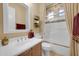 This bathroom offers traditional cabinets and trim and a shower/tub with decorative accents at 1708 W Gambit Trl, Phoenix, AZ 85085