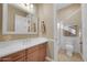 Updated bathroom offers a single sink vanity and tiled shower at 1708 W Gambit Trl, Phoenix, AZ 85085