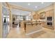 Kitchen with stainless steel appliances, granite countertops, center island, and view to the living room at 1708 W Gambit Trl, Phoenix, AZ 85085