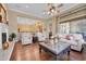 Inviting living room showcasing an open floor plan, hardwood floors, and a fireplace, creating a warm and welcoming space at 1708 W Gambit Trl, Phoenix, AZ 85085