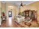 Inviting living room with elegant furnishings, hardwood floors, and a view of the foyer at 1708 W Gambit Trl, Phoenix, AZ 85085