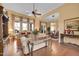 Bright and airy living room featuring hardwood floors, large windows, and stylish furnishings, creating an inviting atmosphere at 1708 W Gambit Trl, Phoenix, AZ 85085