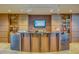 Inviting lobby featuring a reception desk with elegant decor and ambient lighting at 1708 W Gambit Trl, Phoenix, AZ 85085