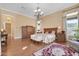 Spacious main bedroom with hardwood flooring, chandelier, and large windows at 1708 W Gambit Trl, Phoenix, AZ 85085