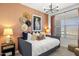 Stylish bedroom featuring a daybed, patterned wallpaper, and modern lighting fixtures at 17801 W Mission Ln, Waddell, AZ 85355