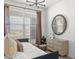 Bright bedroom featuring a daybed, decorative mirror, and modern dresser at 17801 W Mission Ln, Waddell, AZ 85355