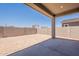 Expansive backyard featuring a covered patio and a block wall, ideal for outdoor enjoyment at 17966 W Long Lake Rd, Goodyear, AZ 85338