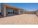Spacious backyard featuring a covered patio, offering plenty of room for outdoor activities at 17966 W Long Lake Rd, Goodyear, AZ 85338