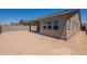 Backyard view with a covered patio, providing ample space for outdoor living and entertaining at 17966 W Long Lake Rd, Goodyear, AZ 85338