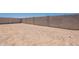 Large backyard enclosed by a block wall, providing privacy and space for outdoor enjoyment at 17966 W Long Lake Rd, Goodyear, AZ 85338