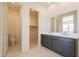 Bathroom featuring double vanity and access to toilet room and walk-in closet at 17966 W Long Lake Rd, Goodyear, AZ 85338