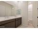 Double vanity bathroom with mirror and tile flooring at 17966 W Long Lake Rd, Goodyear, AZ 85338