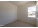 Cozy bedroom featuring a large window providing ample natural light at 17966 W Long Lake Rd, Goodyear, AZ 85338