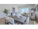 Elegant dining room featuring modern furnishings and view to living room at 17966 W Long Lake Rd, Goodyear, AZ 85338