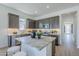 Modern kitchen with stainless steel appliances, granite countertops and an island at 17966 W Long Lake Rd, Goodyear, AZ 85338