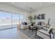 Bright living room features a large sliding glass door and modern decor at 17966 W Long Lake Rd, Goodyear, AZ 85338