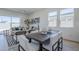 Open-concept living and dining area with modern furnishings and natural light at 17966 W Long Lake Rd, Goodyear, AZ 85338