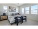 Bright main bedroom with large windows, stylish furniture, and modern decor at 17966 W Long Lake Rd, Goodyear, AZ 85338