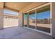 Covered patio with large sliding glass doors, seamlessly connecting indoor and outdoor living spaces at 17966 W Long Lake Rd, Goodyear, AZ 85338