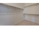 Walk-in closet with built in shelving at 17966 W Long Lake Rd, Goodyear, AZ 85338